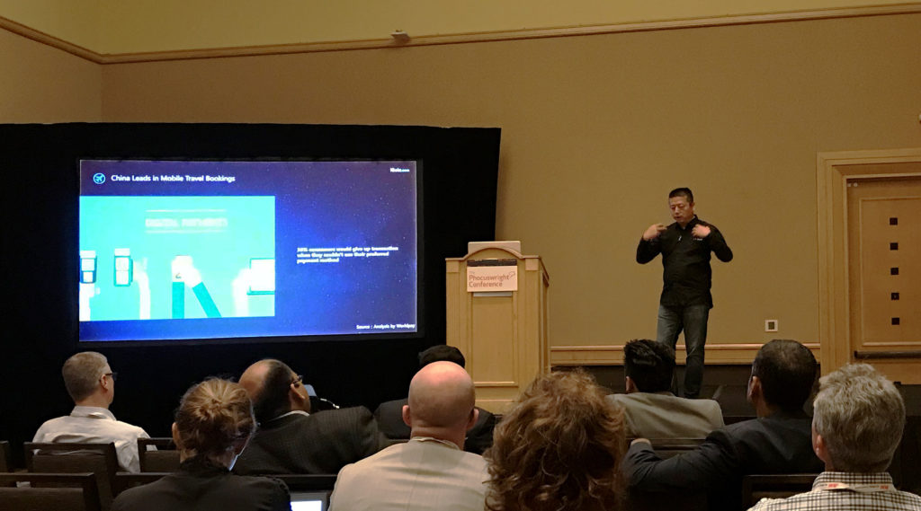 George Zhang, Founder &amp; CEO of iGola, giving a speech at the Phocuswright Conference (Photo: iGola)