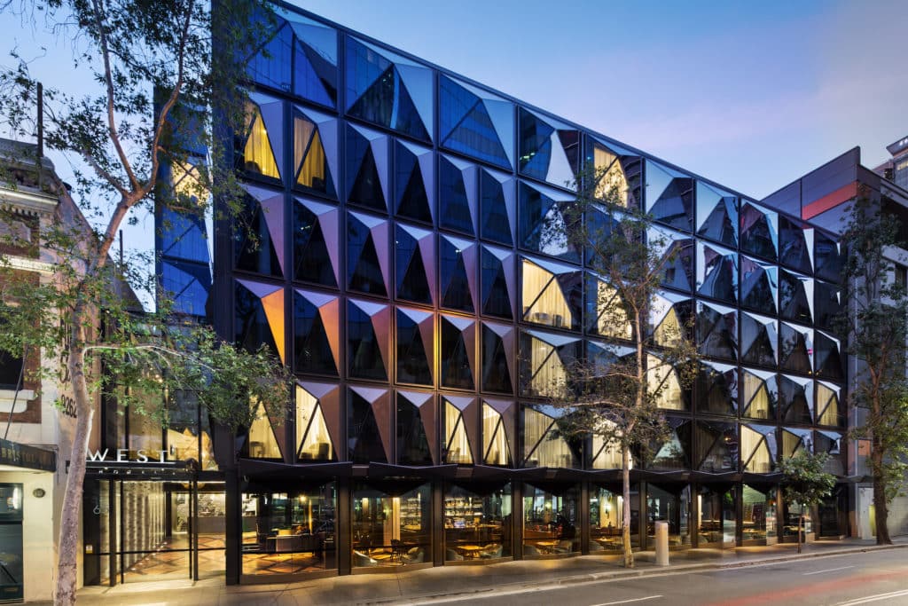 Designed by Australian Architecture firm Fitzpatrick and Partners, with interiors by Woods Bagot, the hotel has a modern classic design theme, featuring deep tones with marble and brass accents (Credit: Curio Collection by Hilton)